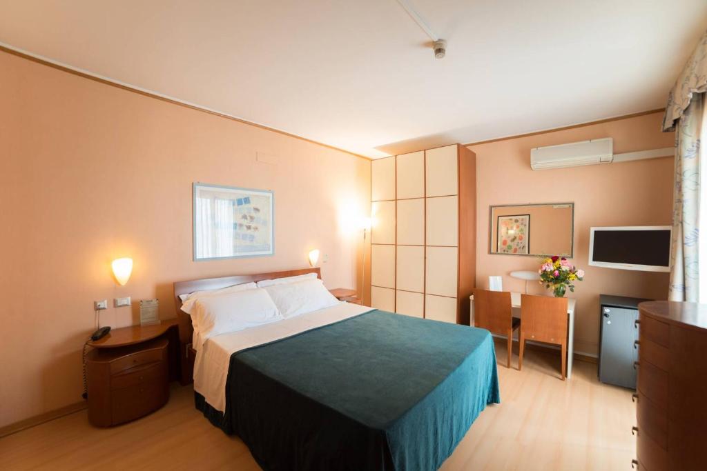 Postel nebo postele na pokoji v ubytování Montebello Park Hotel