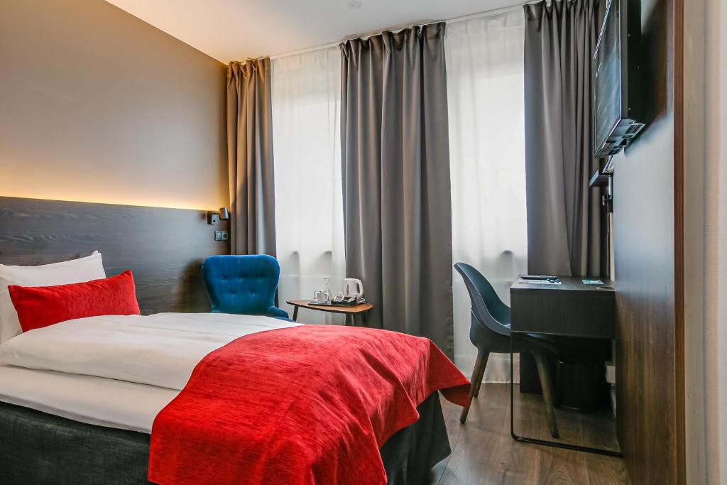 Postel nebo postele na pokoji v ubytování Best Western Hotel Savoy