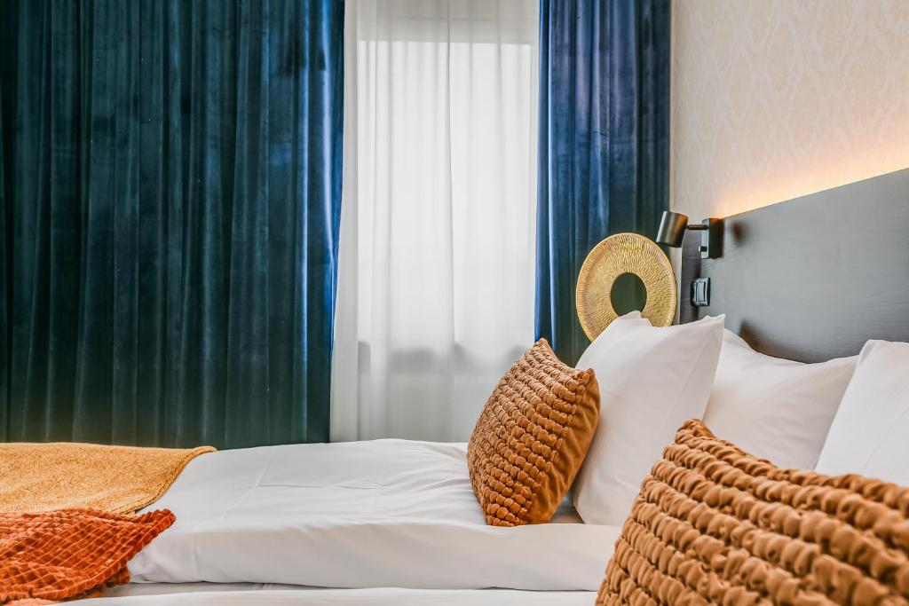 Postel nebo postele na pokoji v ubytování Best Western Hotel Savoy