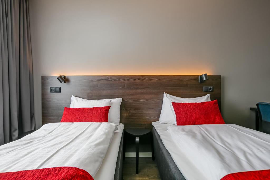 Postel nebo postele na pokoji v ubytování Best Western Hotel Savoy