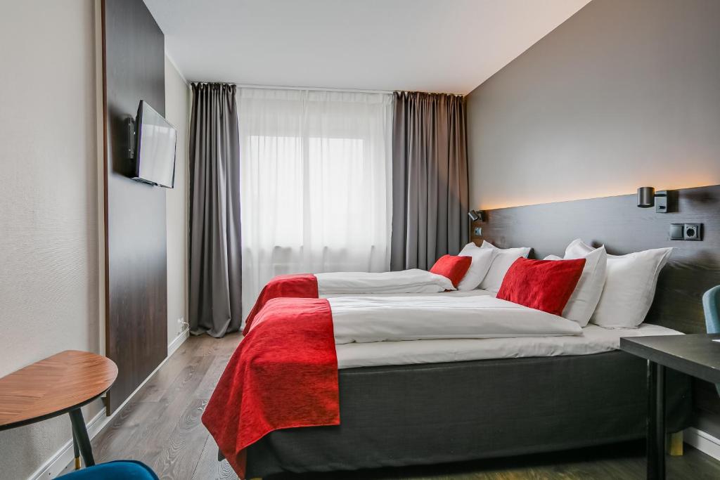 Postel nebo postele na pokoji v ubytování Best Western Hotel Savoy