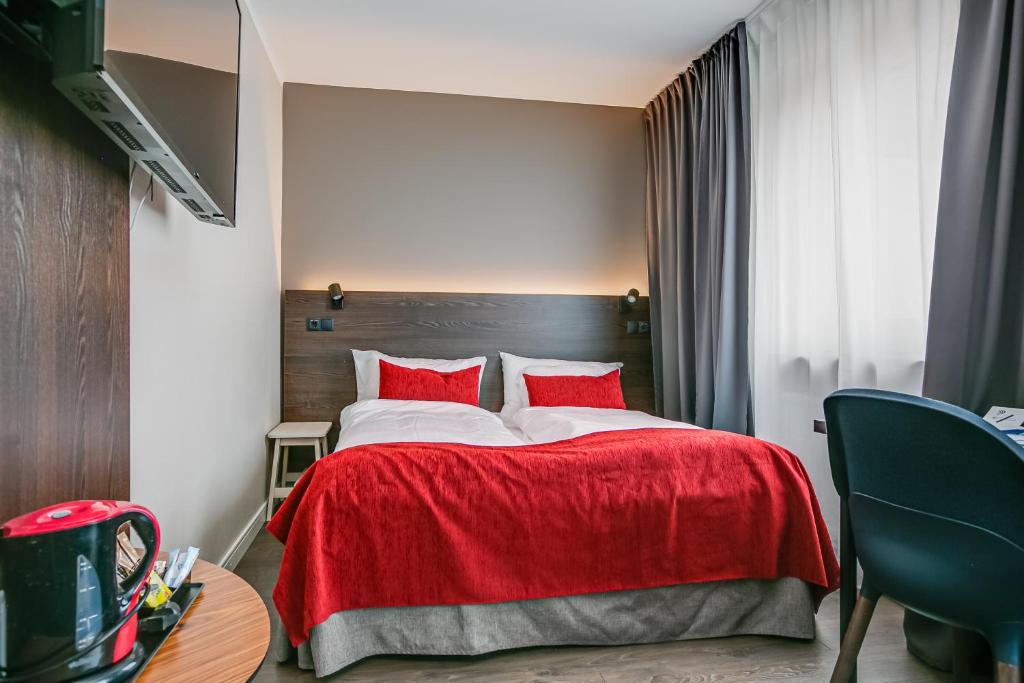 Postel nebo postele na pokoji v ubytování Best Western Hotel Savoy