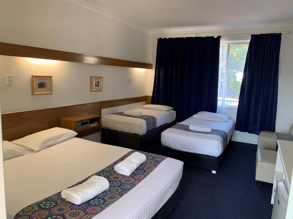 Postel nebo postele na pokoji v ubytování Panorama Motor Inn