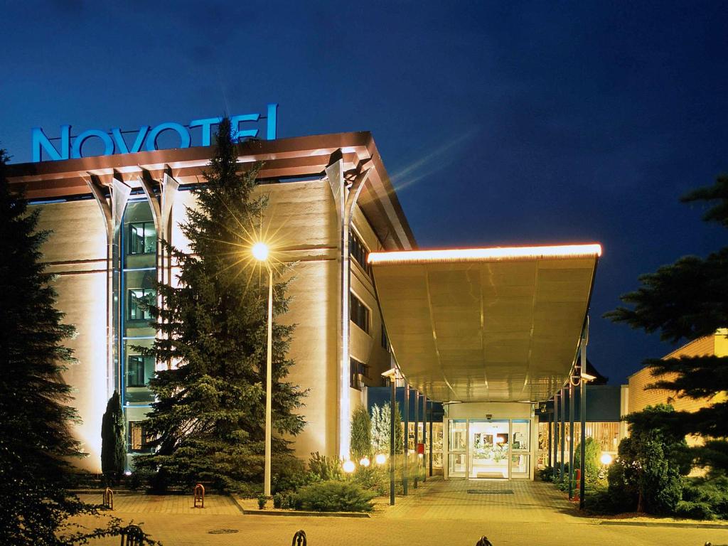 a building with a sign on the side of it at Novotel Gdansk Centrum in Gdańsk