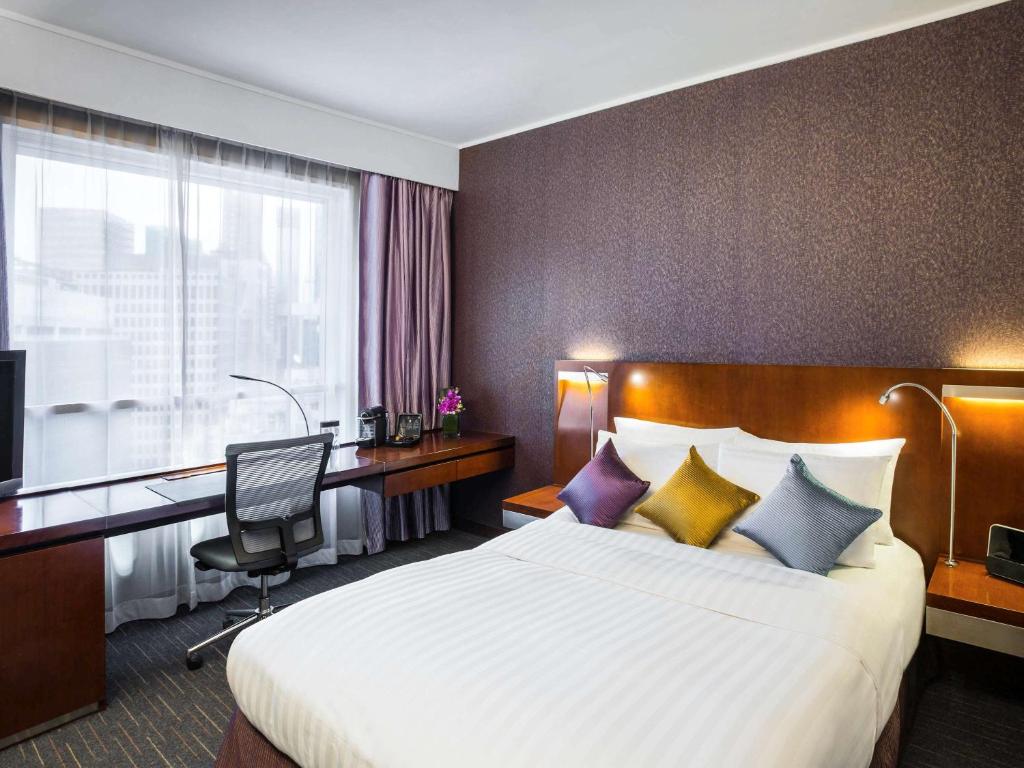 Postel nebo postele na pokoji v ubytování Novotel Century Hong Kong