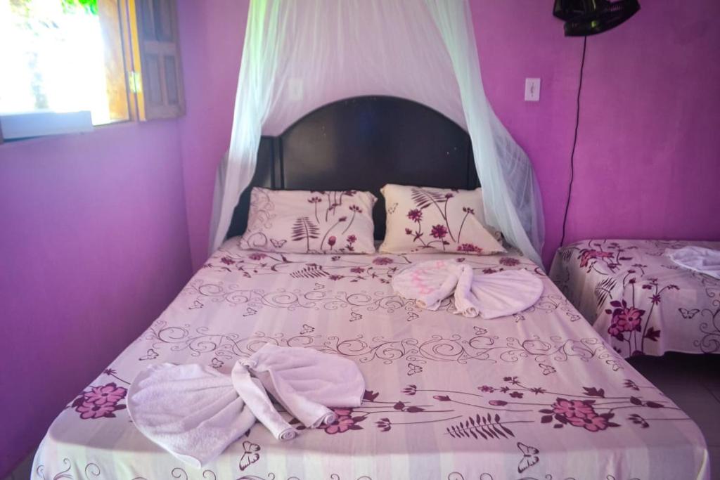 Ένα ή περισσότερα κρεβάτια σε δωμάτιο στο Hospedaria Caribe