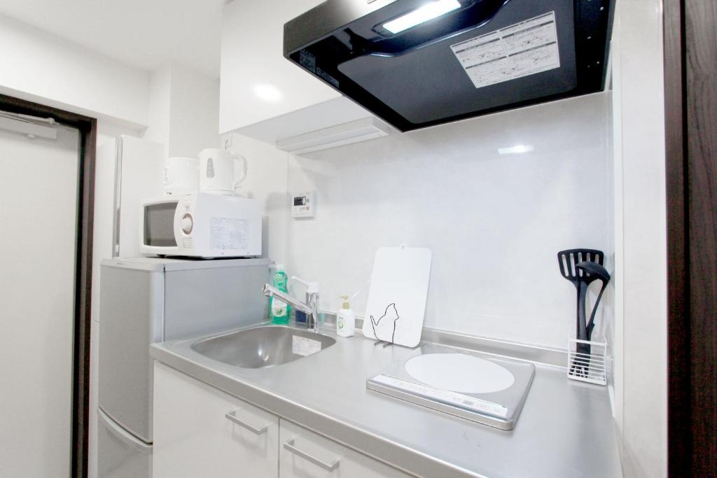 Kuchyň nebo kuchyňský kout v ubytování nestay apartment tokyo nippori
