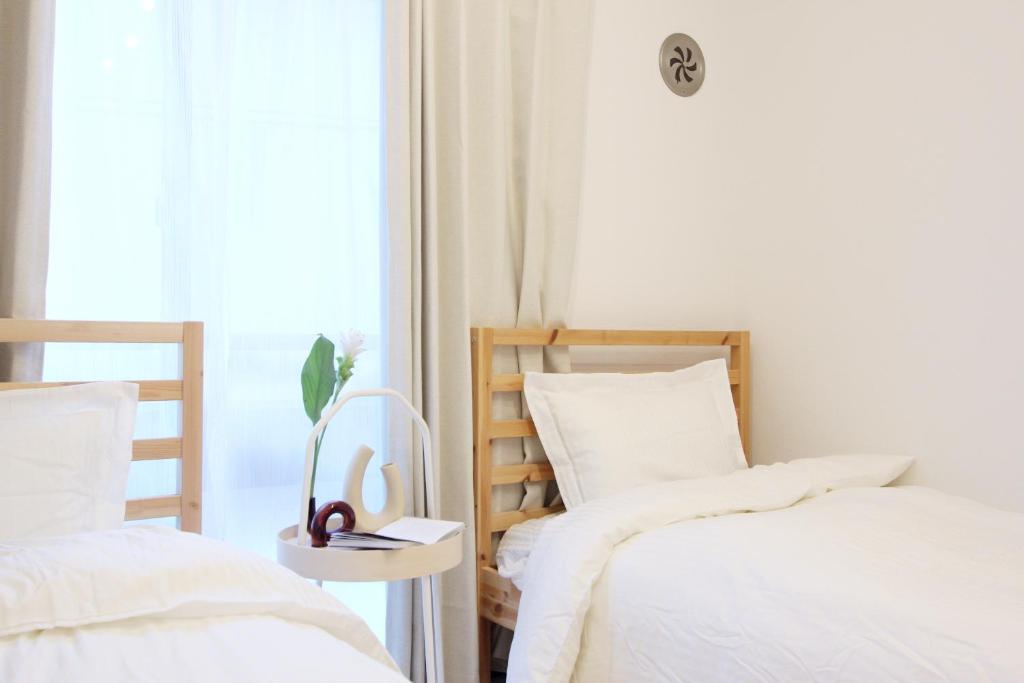 Postel nebo postele na pokoji v ubytování nestay apartment tokyo nippori