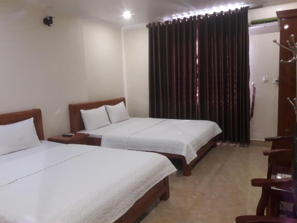 Uma cama ou camas num quarto em Guesthouse Anh Khang
