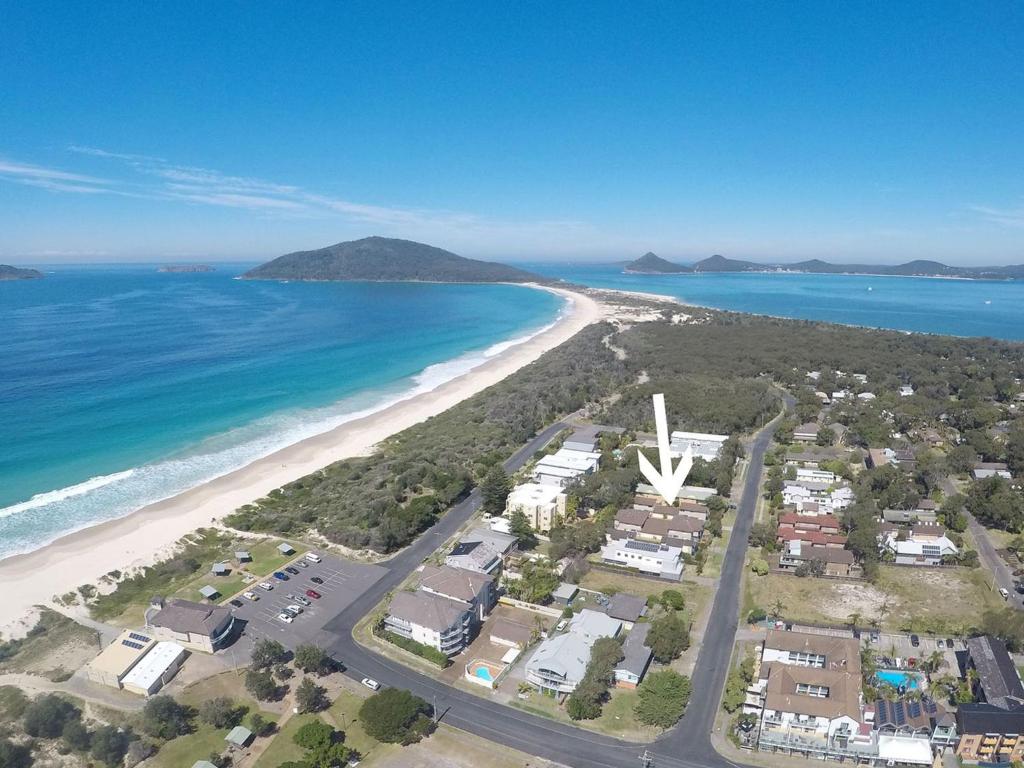 an aerial view of a beach and the ocean at Aquarius Townhouse in Hawks Nest