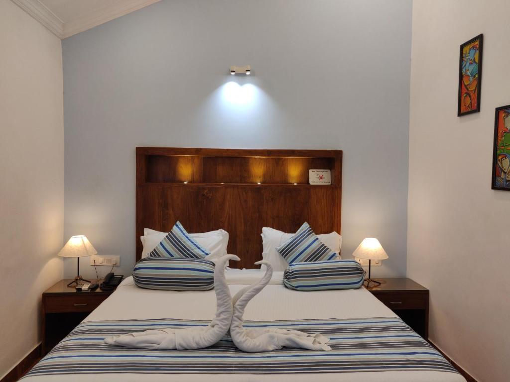 Postel nebo postele na pokoji v ubytování Santana Beach Resort