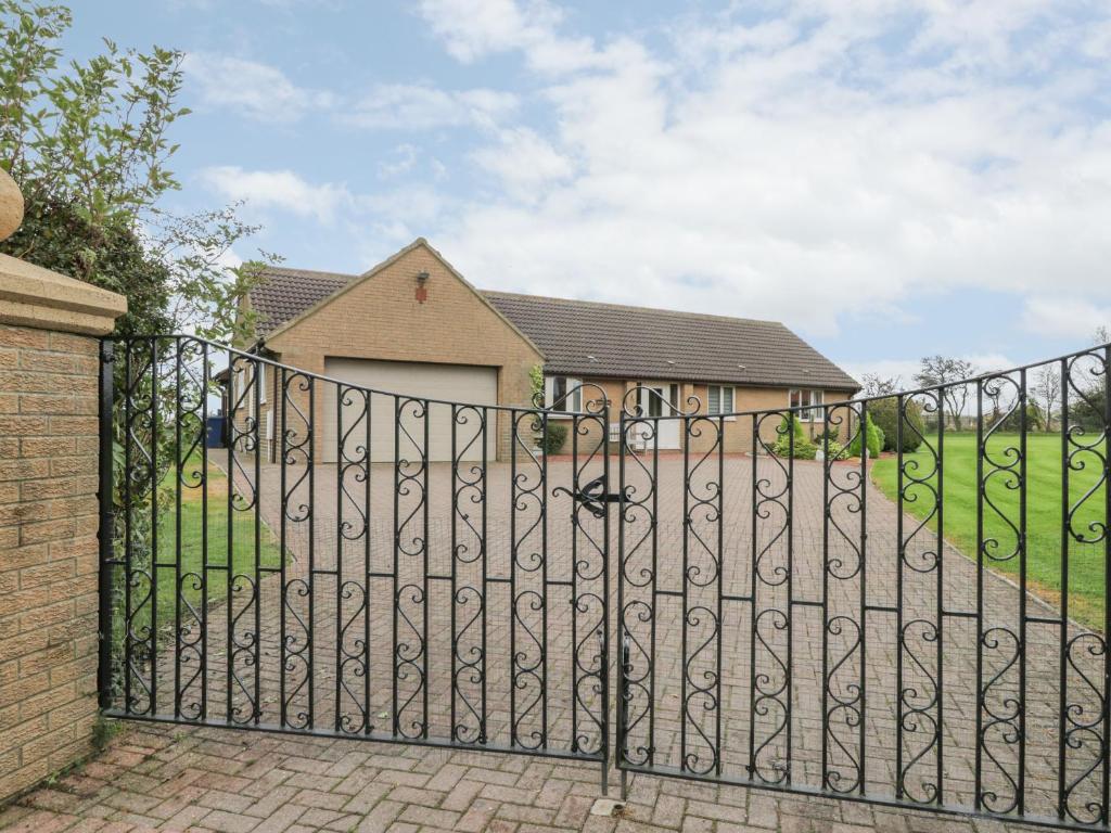 a wrought iron gate in front of a house at Holly Edge in Saltburn-by-the-Sea