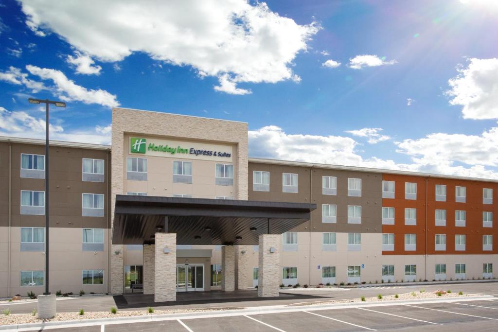 an image of an office building with a parking lot at Holiday Inn Express & Suites - Rapid City - Rushmore South by IHG in Rapid City