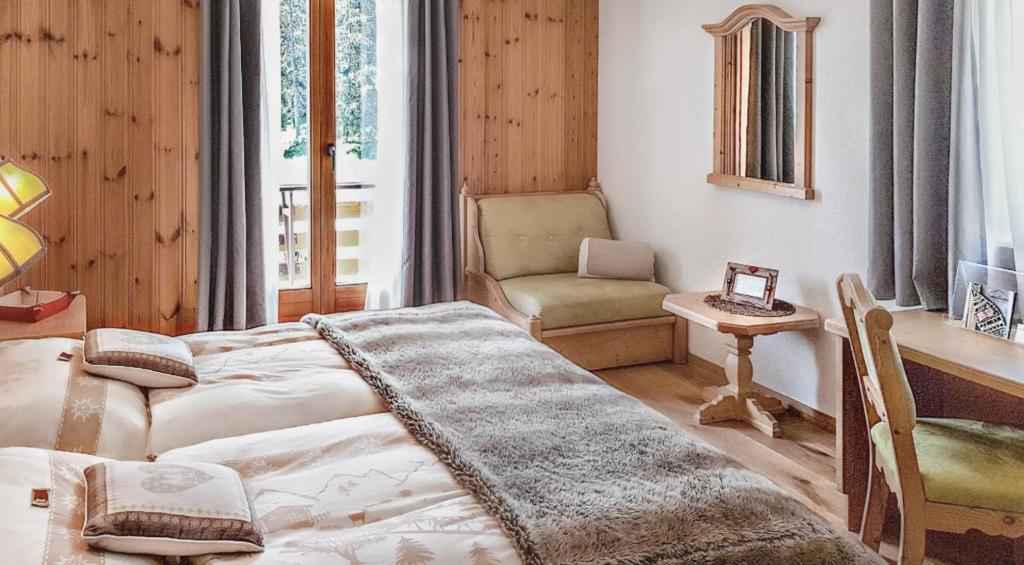 Postel nebo postele na pokoji v ubytování Hotel La Cambuse