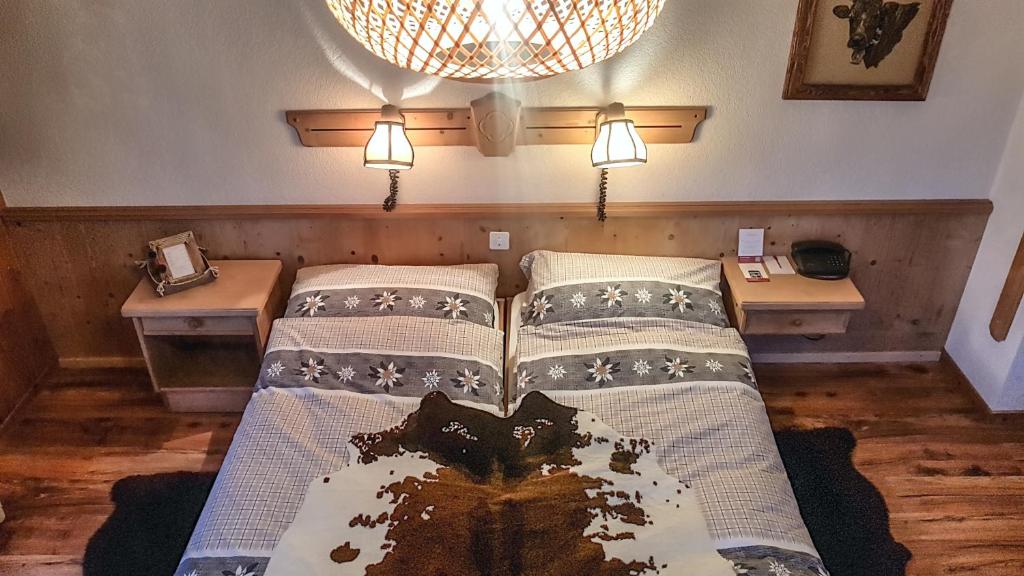 Postel nebo postele na pokoji v ubytování Hotel La Cambuse