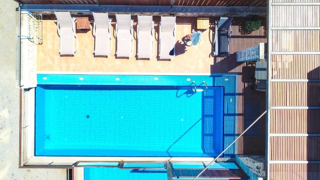 an overhead view of a swimming pool in a building at Corali Villas in Kolymvari