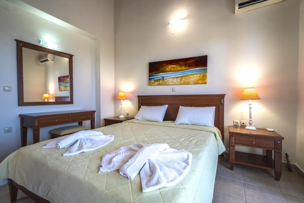 Postel nebo postele na pokoji v ubytování Corali Villas