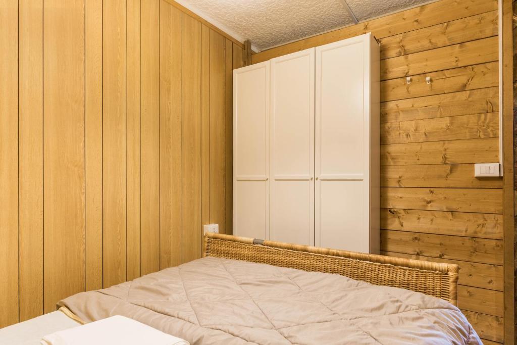 A bed or beds in a room at Appartamento Volpi
