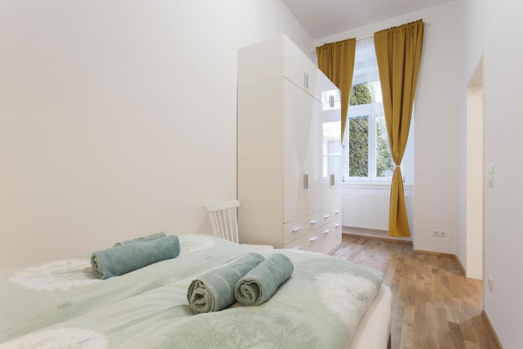 Łóżko lub łóżka w pokoju w obiekcie GAL Apartments Vienna