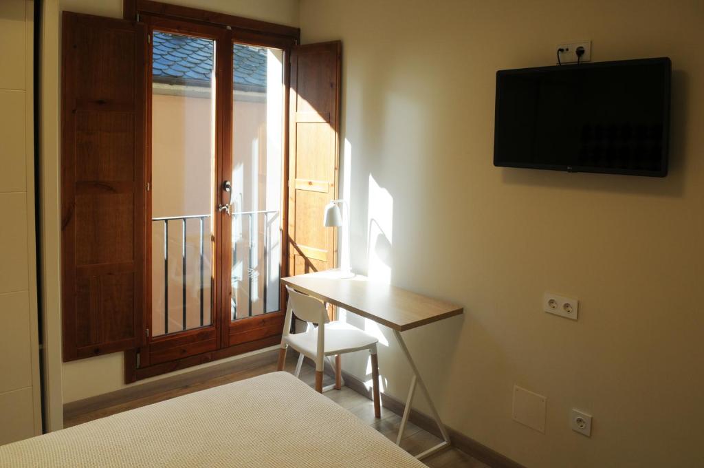 TV a/nebo společenská místnost v ubytování APARTAMENTOS TURÍSTICOS GUIANA