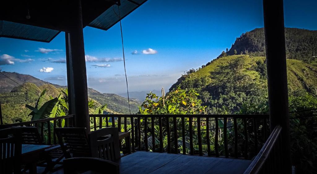 a balcony with a view of a mountain at Blooming Rose Ella in Ella