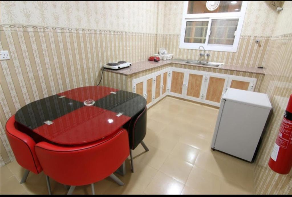 Kuchyň nebo kuchyňský kout v ubytování DREAMLAND HOTEL APARTMENT NIZWA