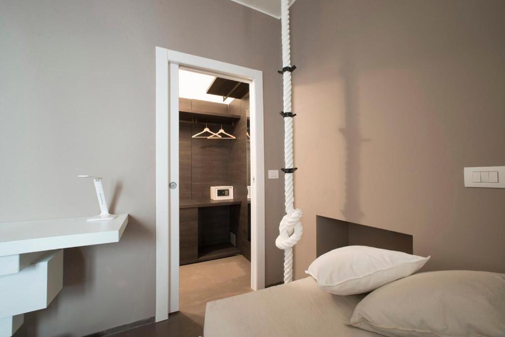 Posteľ alebo postele v izbe v ubytovaní L'Ottava GuestHouse