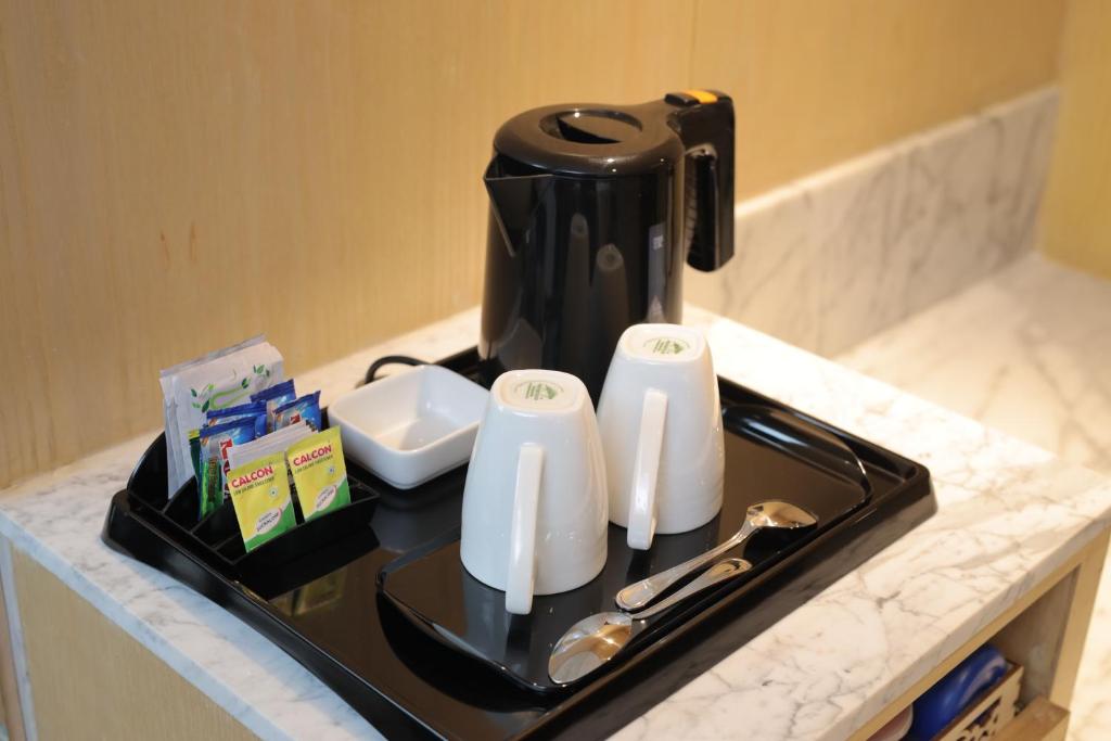 Příslušenství pro přípravu čaje a kávy v ubytování Best Western Darbar