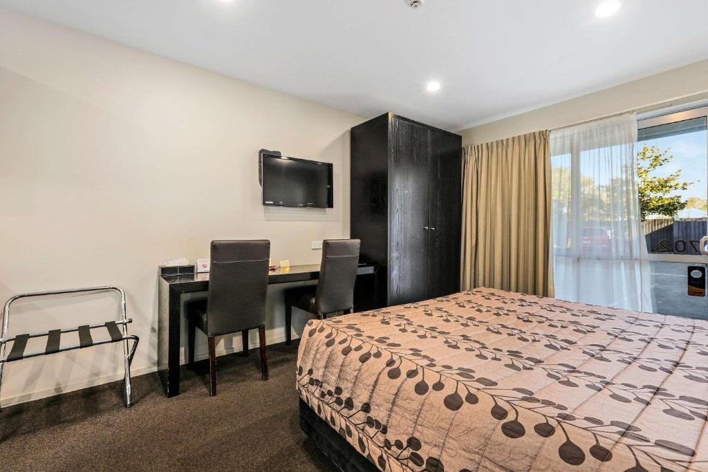 Postel nebo postele na pokoji v ubytování Quality Suites Amore