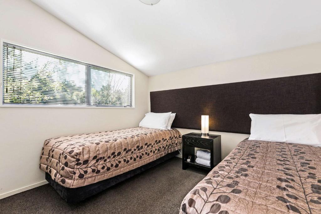 Postel nebo postele na pokoji v ubytování Quality Suites Amore