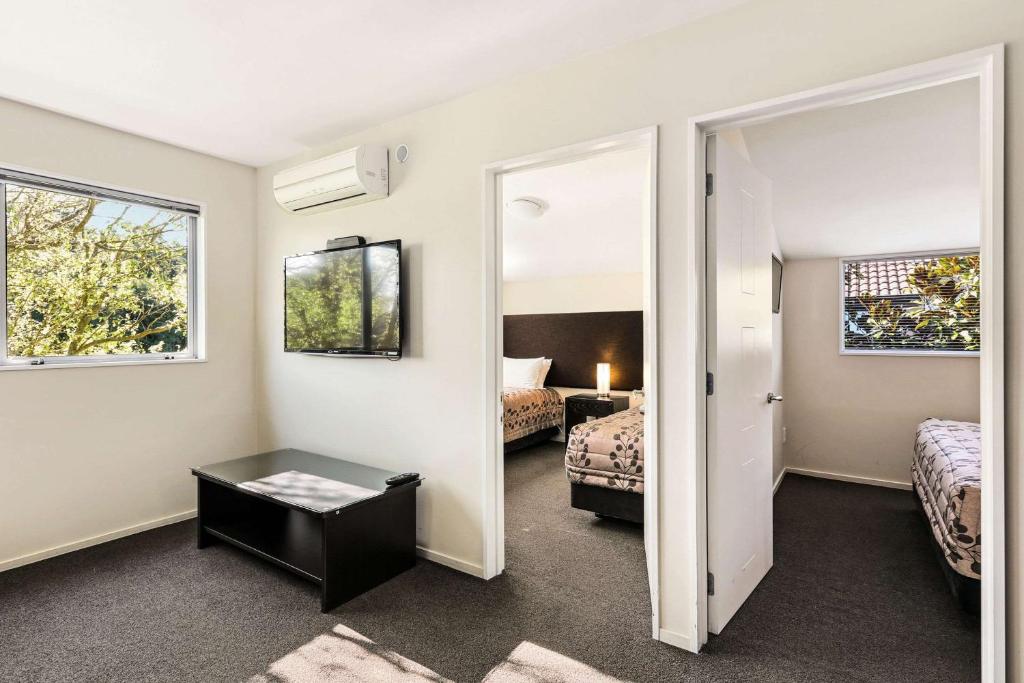 Postel nebo postele na pokoji v ubytování Quality Suites Amore