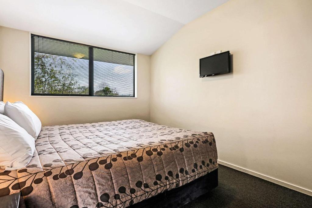 Postel nebo postele na pokoji v ubytování Quality Suites Amore
