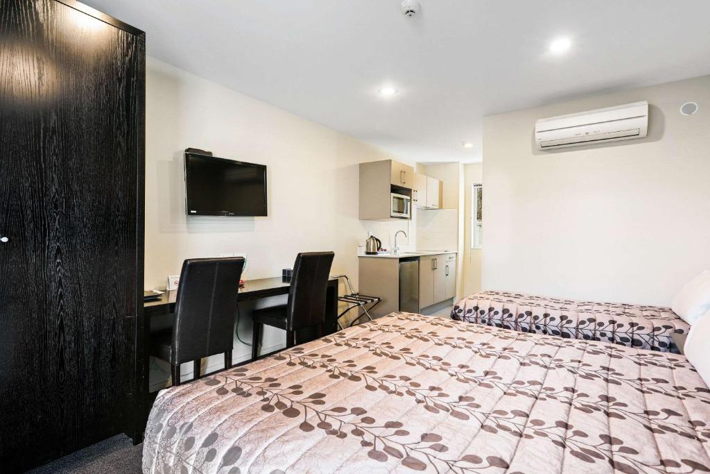 Postel nebo postele na pokoji v ubytování Quality Suites Amore