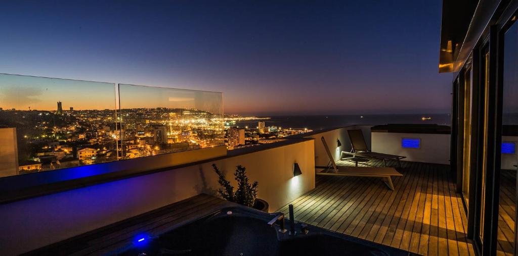 a view of a city at night from a building at Lamaraz Hotels in Alger