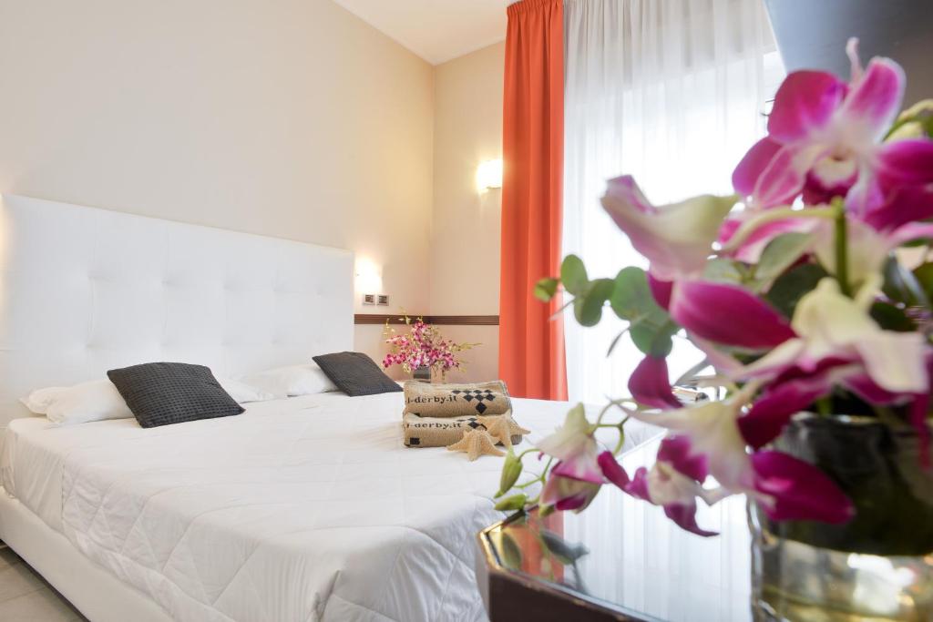 Postel nebo postele na pokoji v ubytování Hotel Derby