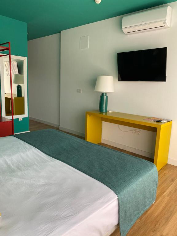 Postel nebo postele na pokoji v ubytování Hotel Ritual Maspalomas - Adults Only