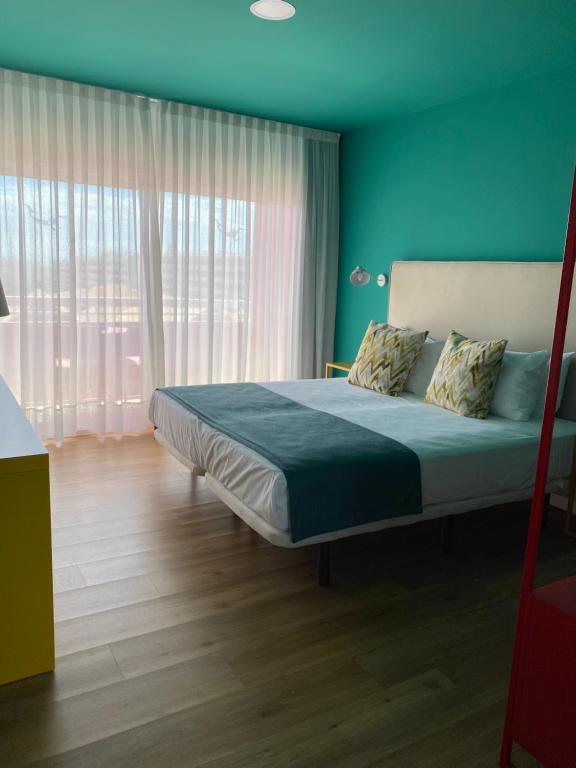 Postel nebo postele na pokoji v ubytování Hotel Ritual Maspalomas - Adults Only