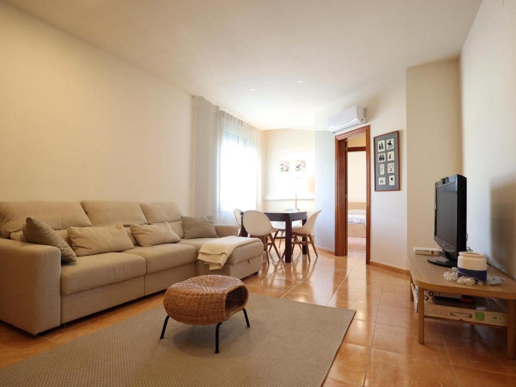 a living room with a couch and a table at D22145 reina elisenda in Sant Feliu de Guíxols