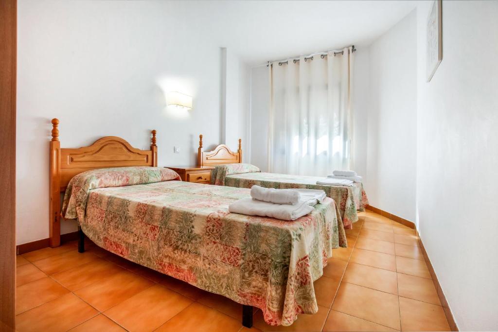 Posteľ alebo postele v izbe v ubytovaní Apartaments Palamós - Pal Beach