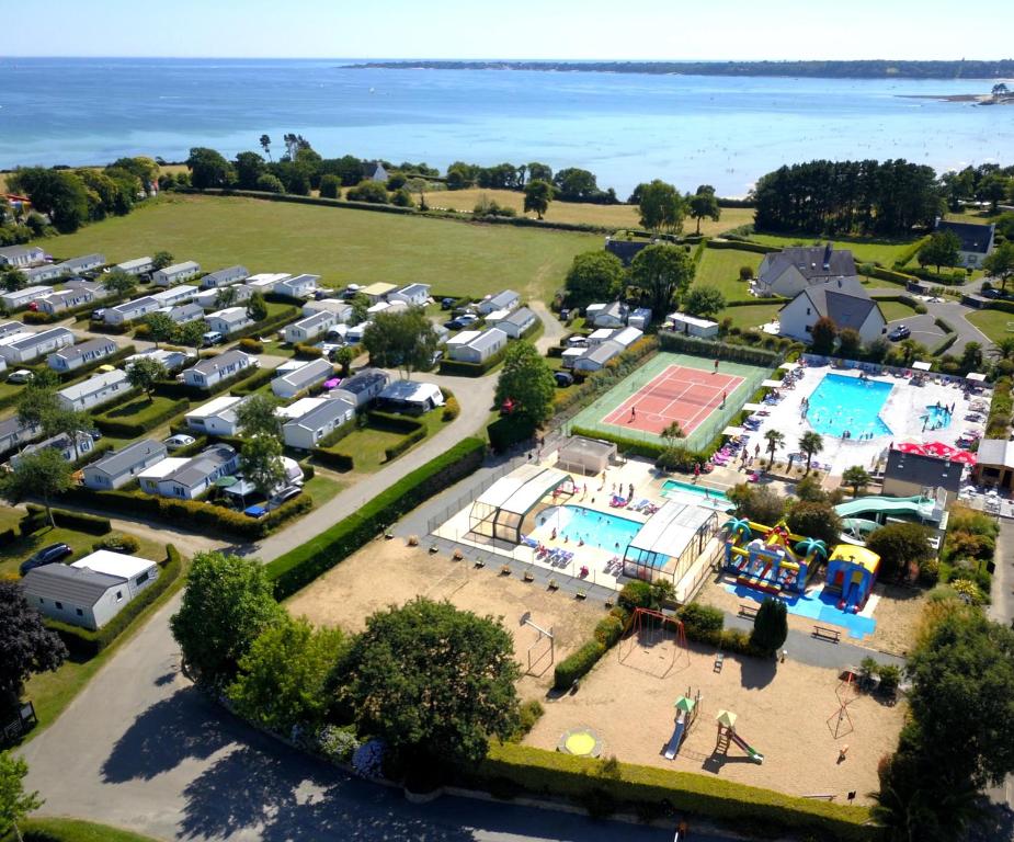 an aerial view of a park with a tennis court at Camping de Keranterec in La Forêt-Fouesnant