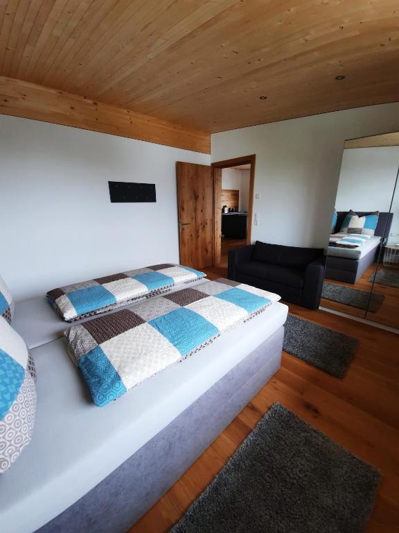 A bed or beds in a room at Alpha Apartment