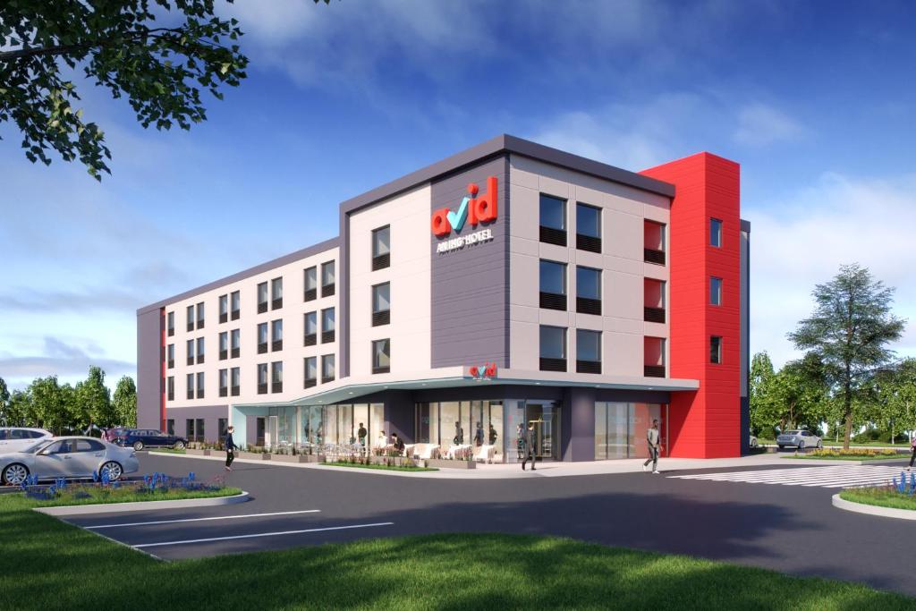 an artists rendering of the hotel planned for the corner of the street at Avid Hotels - Cincinnati N - West Chester, an IHG Hotel in West Chester