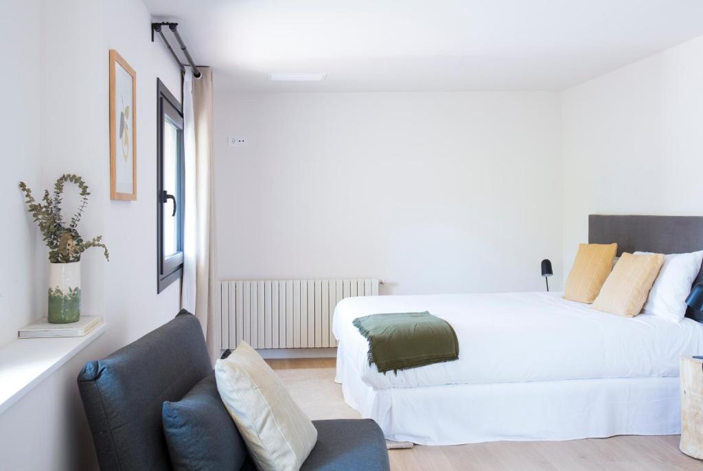 Postel nebo postele na pokoji v ubytování Hotel Rural Mas de l'Illa