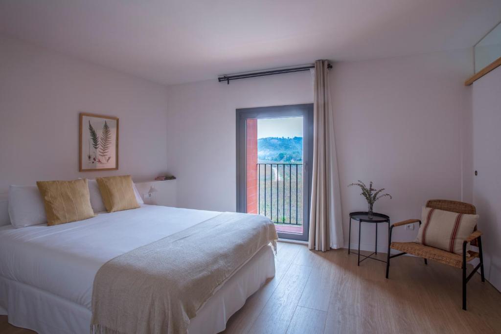 Postel nebo postele na pokoji v ubytování Hotel Rural Mas de l'Illa
