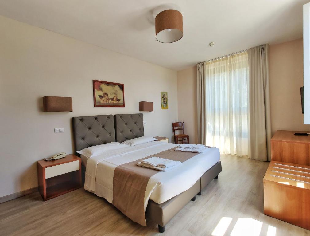 Postel nebo postele na pokoji v ubytování Toscana Verde