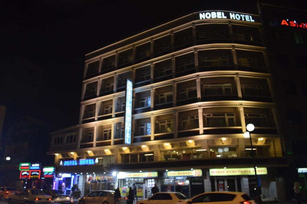 a building on a city street at night at Nobel Hotel Ankara in Ankara