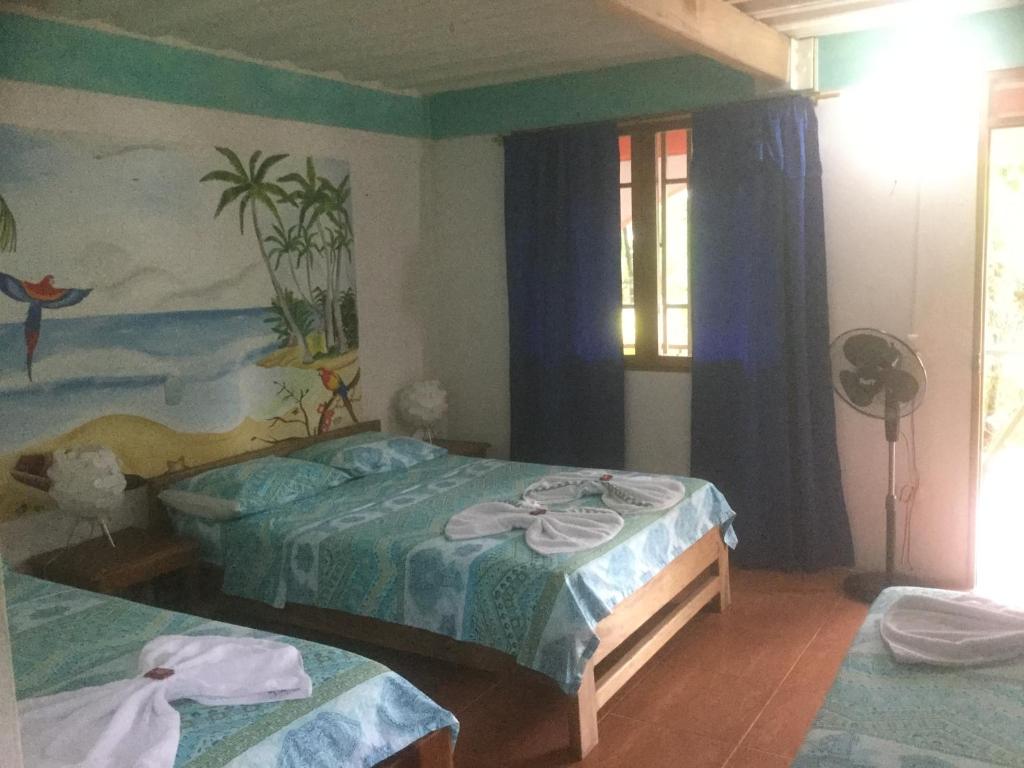 Cama o camas de una habitación en Cabañas Tucan Eco Hotel