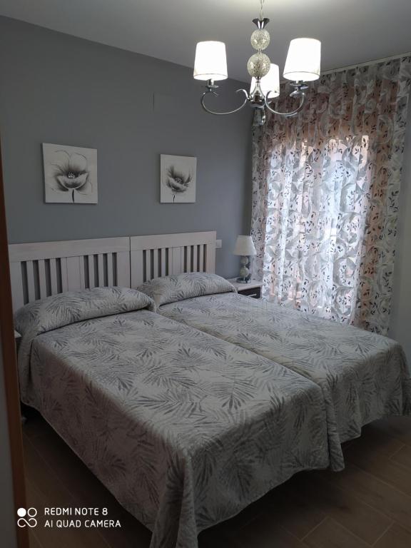 Postel nebo postele na pokoji v ubytování Apartamentos Alameda