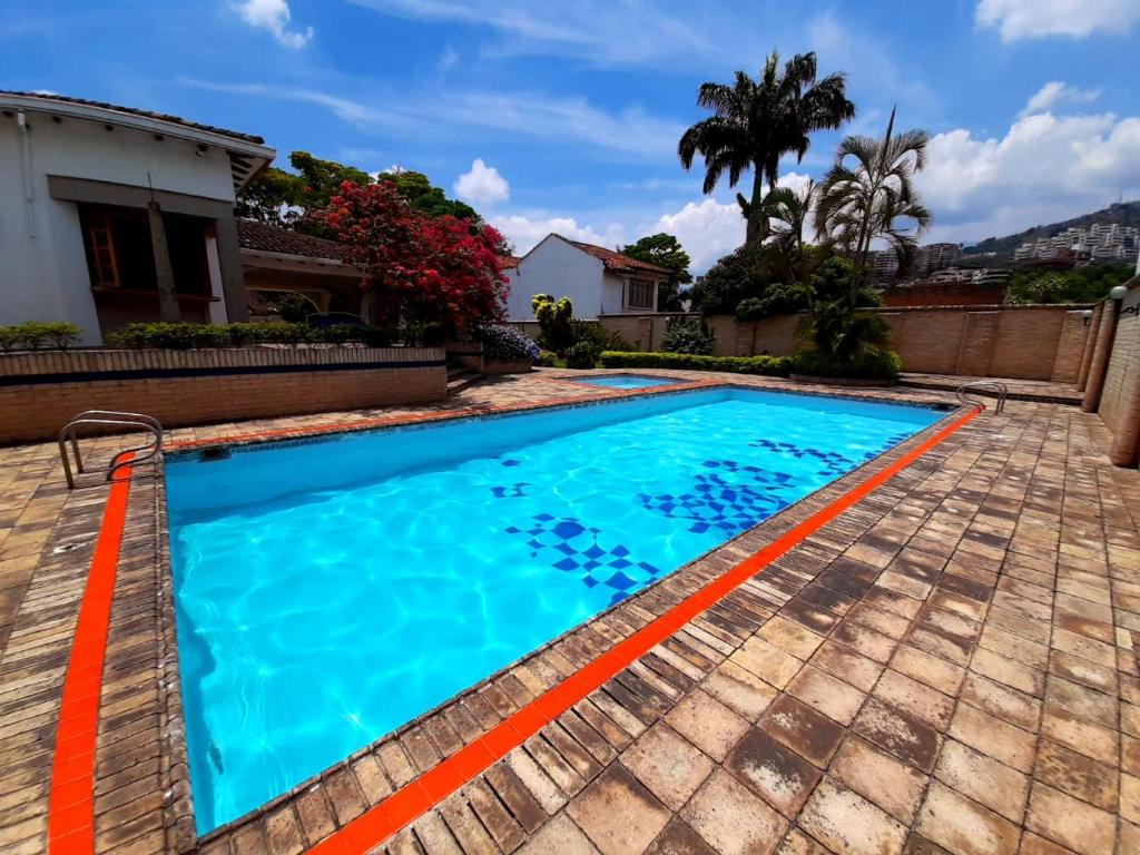 a swimming pool in the backyard of a house at Casa Veraneras de San Fernando in Cali