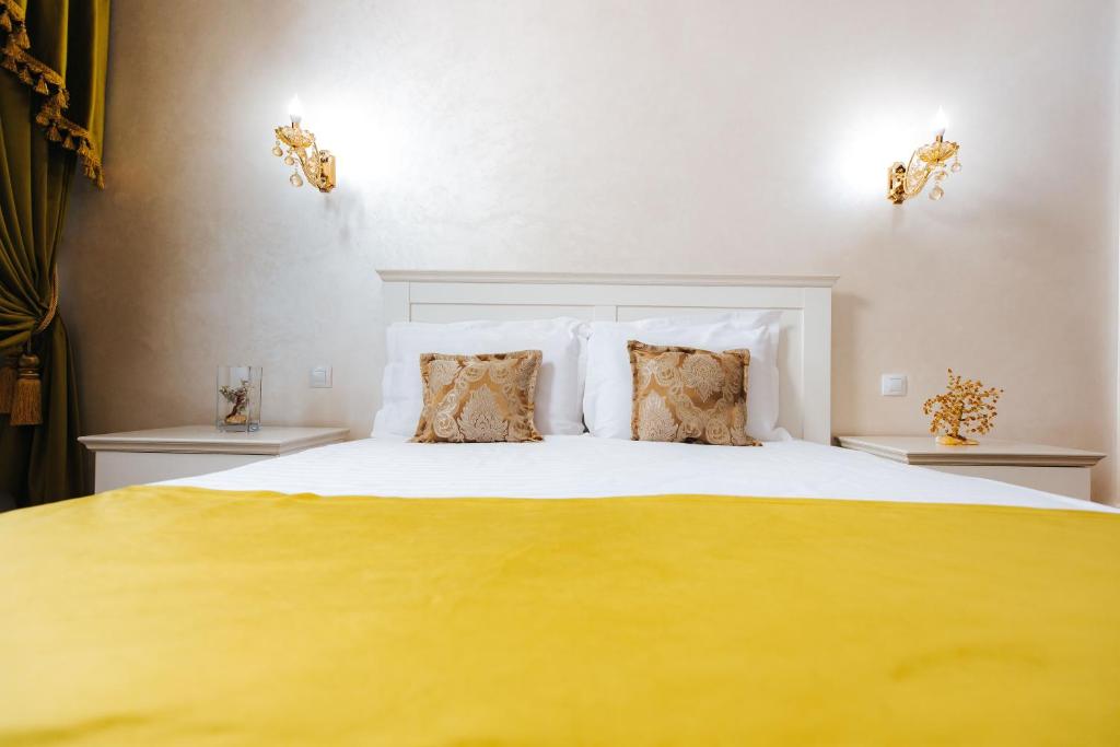 Postel nebo postele na pokoji v ubytování Hotel Evianne Boutique